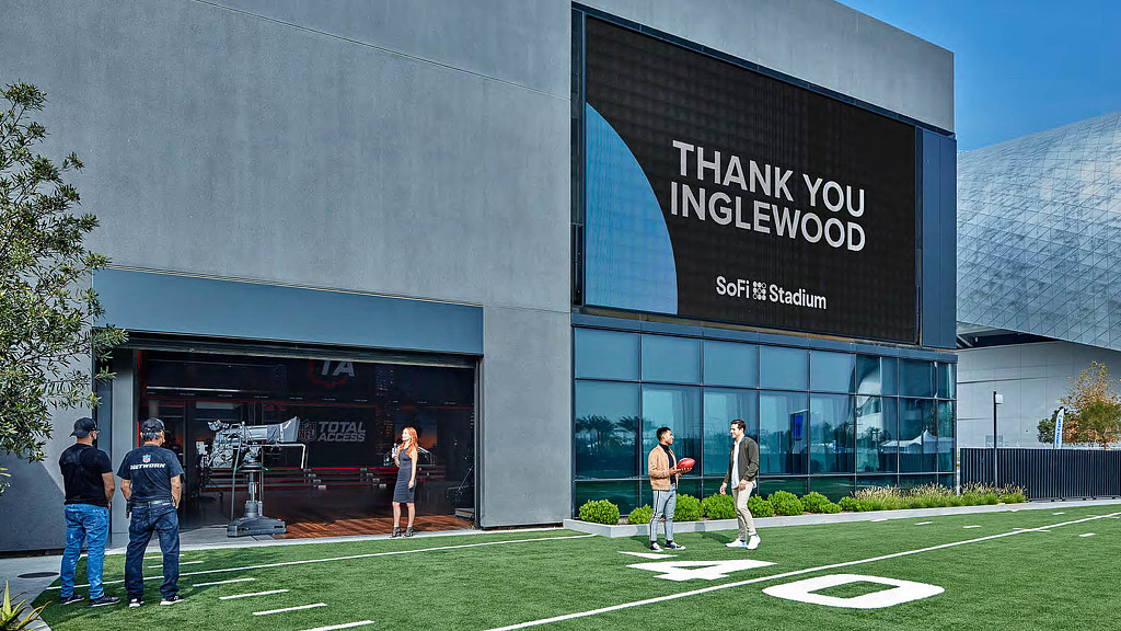 A group of people standing outside a building.